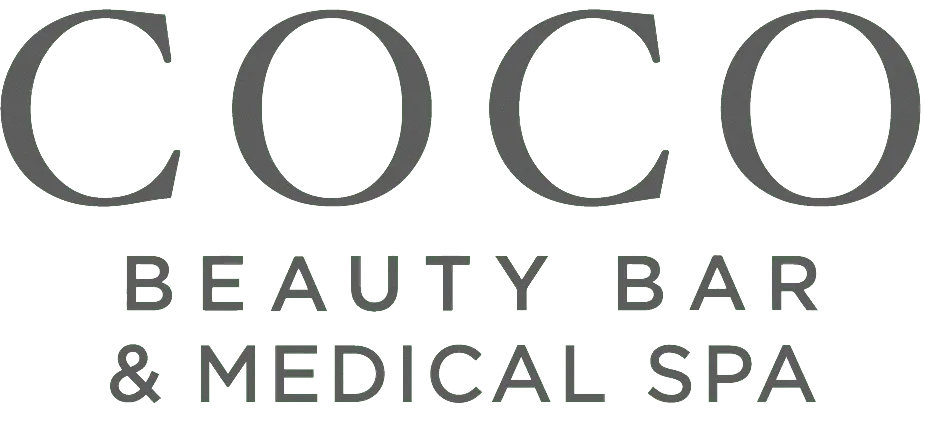 A black and white image of the logo for oc beauty bar.